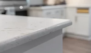 Side view comparison of 2cm and 3cm stone countertop thickness for kitchen remodeling in Massachusetts.