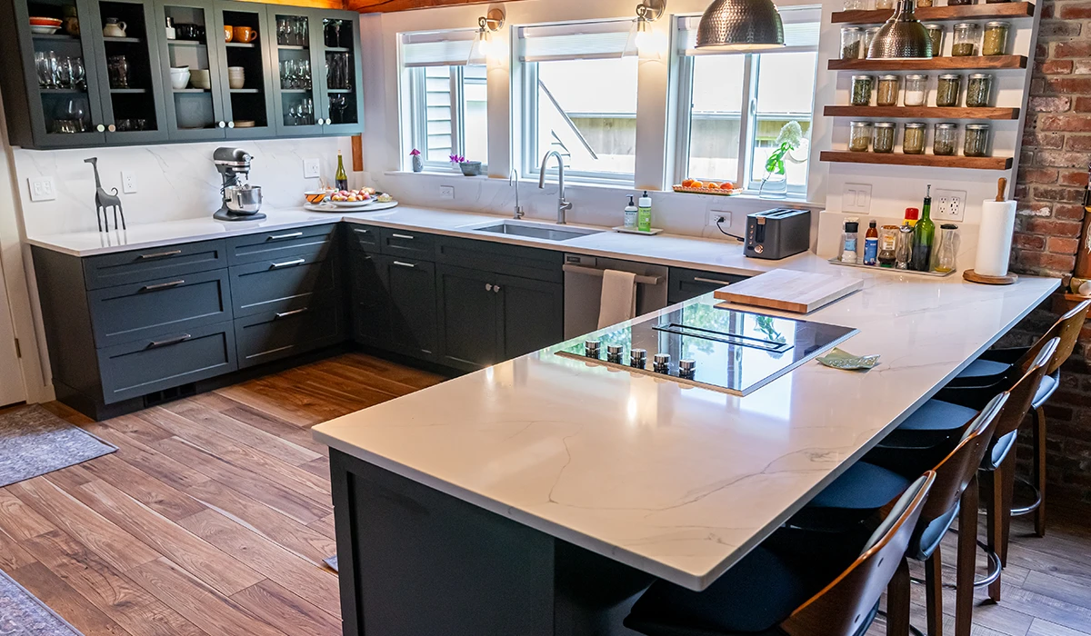 Modern kitchen with luxury stone island showing the best countertop material for home durability.